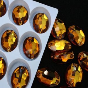 Topaz színű ovális alakú kristály