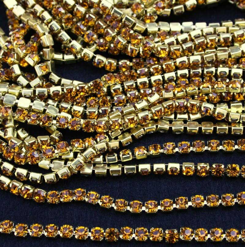 Arany strasszlánc topáz színű kővel